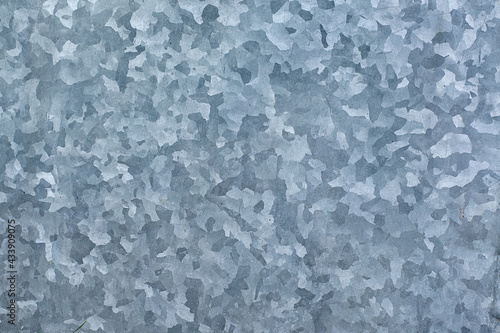 Galvanized sheet metal plate texture. Metal plate with galvanized coating and zinc contents. Corrosion resistant durable product for outdoor applications - roofing and construction applications.