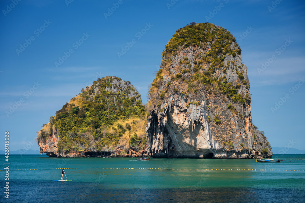 Naklejka premium Female tourist surfboard at Phra Nang beach, Krabi