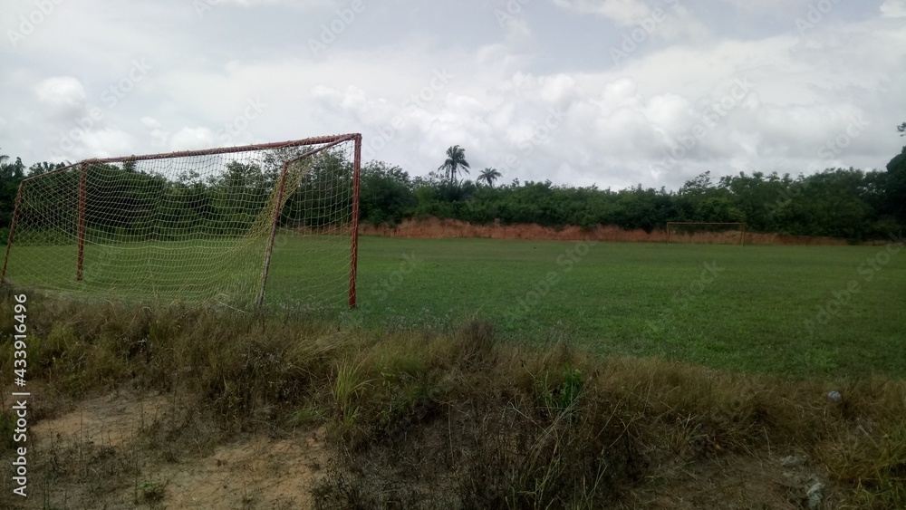 A green football pitch in Ghana, Africa.