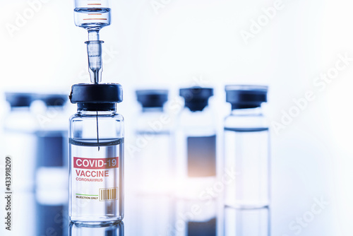 Vaccine coronavirus development vial dose flu shot drug needle syringe, medical concept vaccination hypodermic injection treatment disease care hospital prevention immunization illness disease.