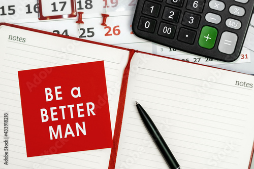 Be a better man - concept of text on sticky note