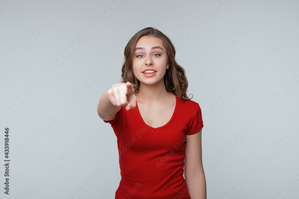 ItS your fault. Displeased young brunette woman is pointing finger at camera and to you, angry and furious with you ItS your fault. Displeased young brunette woman is pointing finger at camera and to you, angry and furious with you