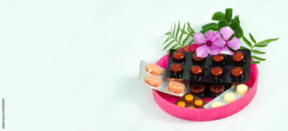 medicinal tablets in a plastic cap with leaf nature symbol - medical concept