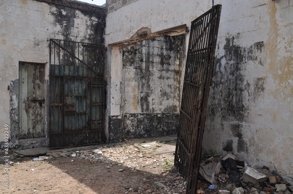 Gate of an abandoned prison in a fort in Ghana.