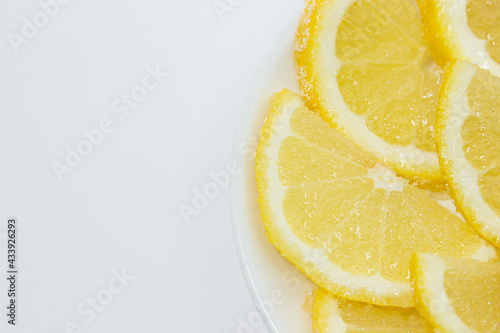 Lemon in sugar. Lemon wedges sprinkled with sugar. Fruit in sugar