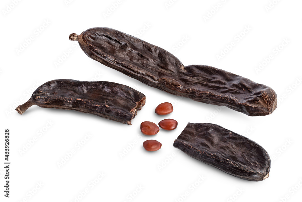 Obraz premium Ripe carob pods and bean isolated on white background with clipping path and full depth of field