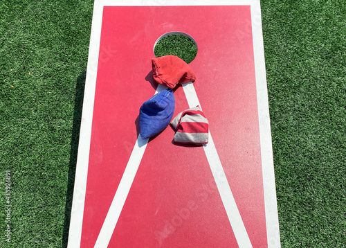 Corn hole game with bean bags on a turf field photo