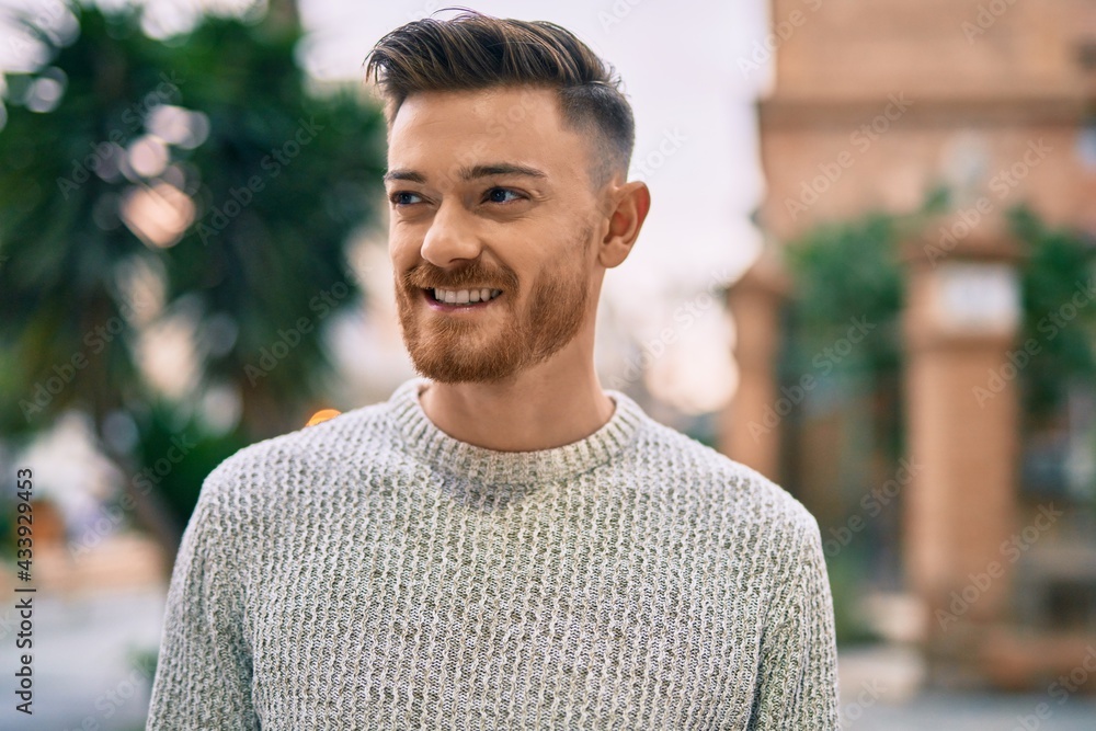 Young caucasian man smiling happy standing at the city. Young caucasian man smiling happy standing at the city.