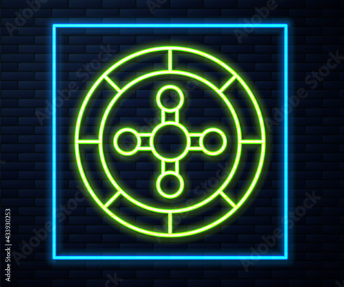 Glowing neon line Casino roulette wheel icon isolated on brick wall background. Vector