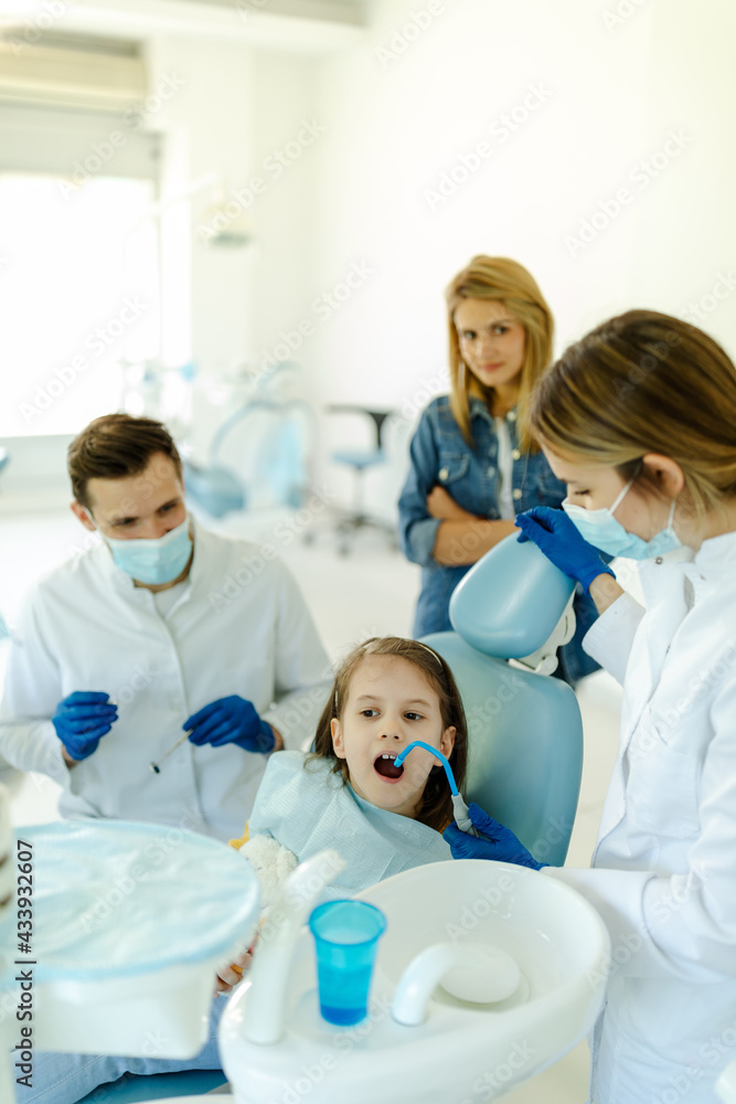 Little girl is not afraid to show teeth to dentist. Prophylactic examinations child at dentist. Little girl is not afraid to show teeth to dentist. Prophylactic examinations child at dentist.