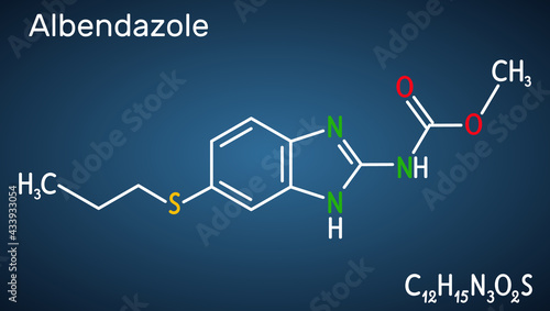 Albendazole molecule. It is is broad-spectrum, synthetic benzimidazole-derivative anthelmintic, used in treatment of parasitic worm infestations. Dark blue background