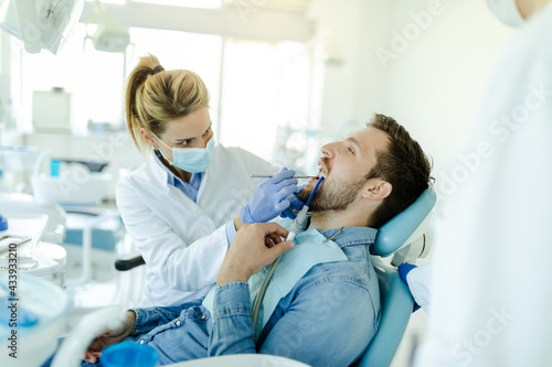 Young man visit dentistry clinic for professional teeth treatment.
