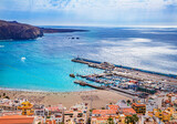 Aerial view of Los Cristianos beach, coast and the ocean in the summertime in Tenerife island - Spain