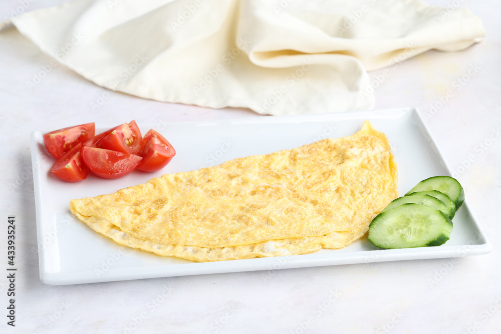 Omelette on wooden background. Local name omlet Omelette on wooden background. Local name omlet