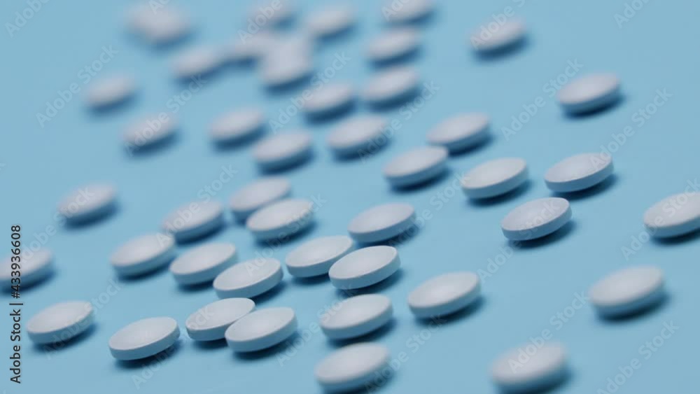 mall, blue pills on a blue background mall, blue pills on a blue background
