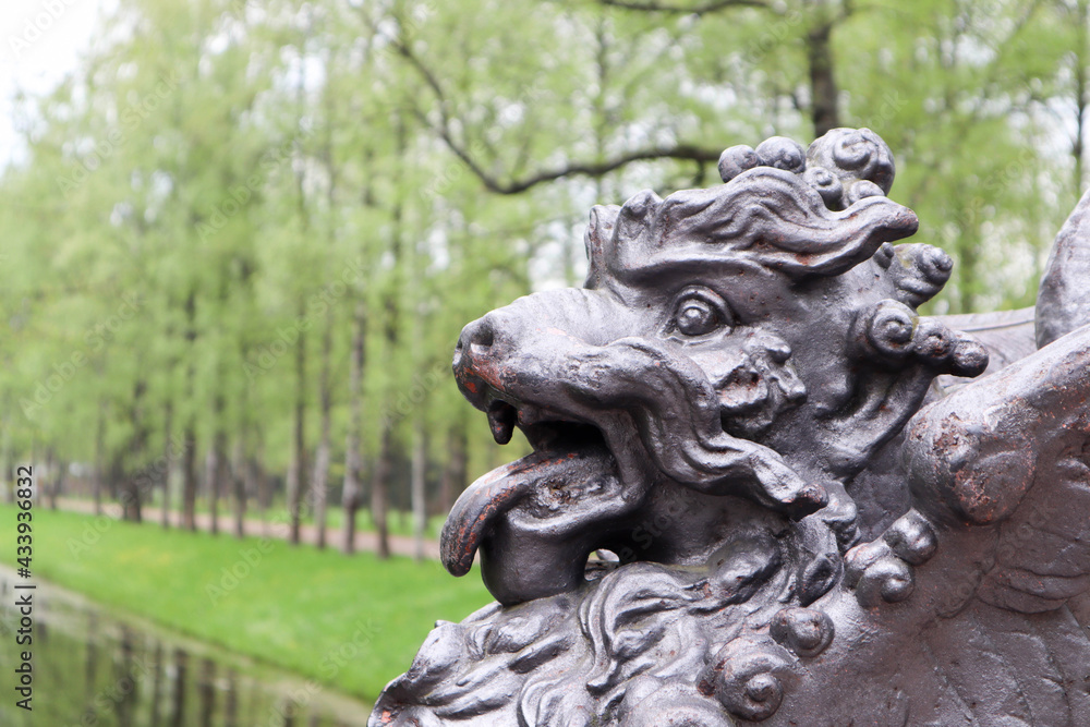 lion statue on the bridge in the park springtime
