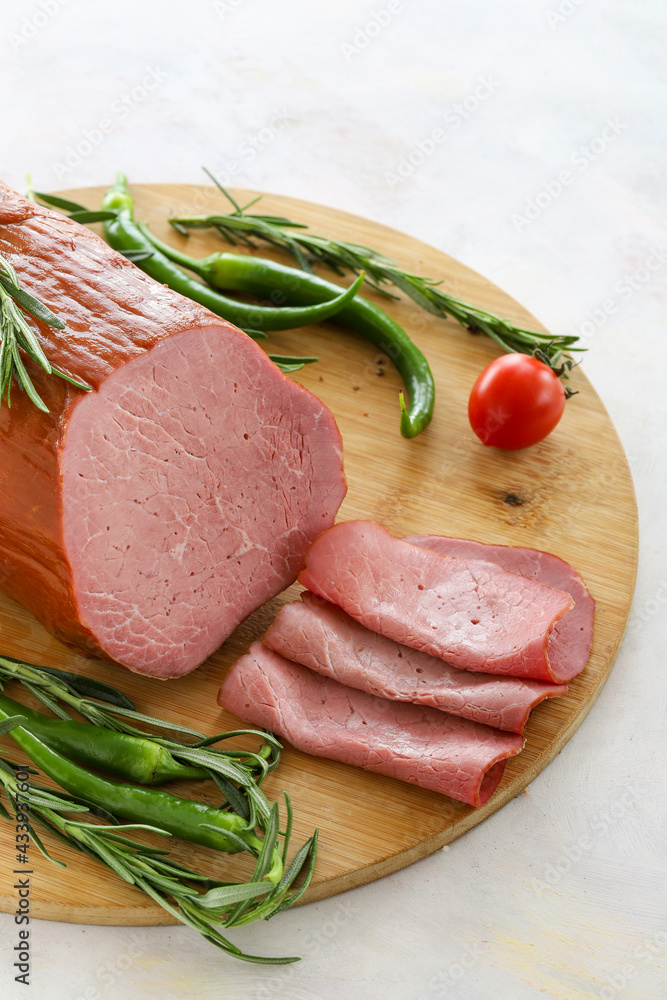 Roast beef on cutting board. Wooden background. Local name sade roast beef Roast beef on cutting board. Wooden background. Local name sade roast beef