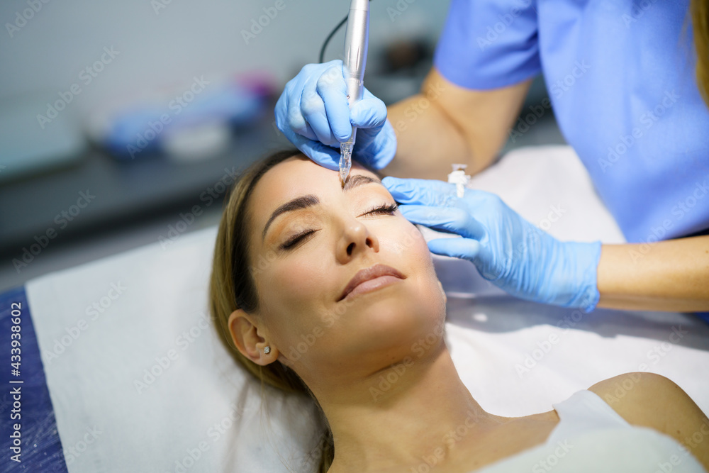 Permanent make-up for eyebrows of beautiful woman in a beauty salon. Micropigmentation treatment. Permanent make-up for eyebrows of beautiful woman in a beauty salon. Micropigmentation treatment.