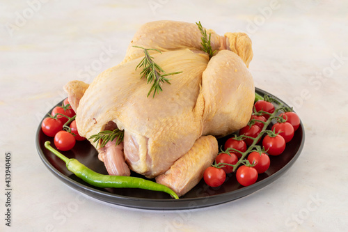 raw whole chicken on a white wooden background. Chicken Meat background.