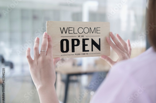 Open. barista, Coffee shop owner with face mask turning open sign board on glass door cafe shop, cafe restaurant, retail store, small business owner, open and close label concept