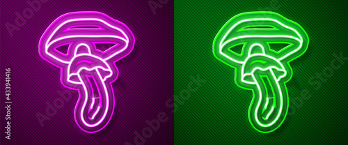 Glowing neon line Psilocybin mushroom icon isolated on purple and green background. Psychedelic hallucination. Vector