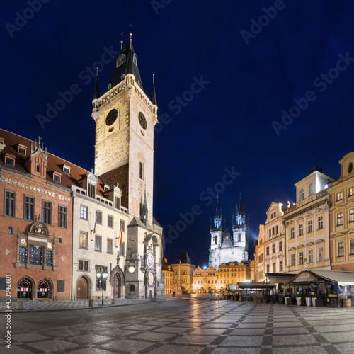 The old town square of Prague, Czech Republic, during dusk without people surrounded by the historical, gothic style buildings and the famous Tyn Church. Stroll around Prague's old town Romantic night