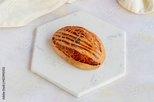 Pastry with olives on a white wooden background. Local name zeytinli poğaça photo