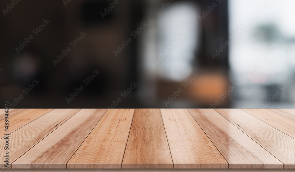 Empty wooden table top with lights bokeh on blur restaurant background. Empty wooden table top with lights bokeh on blur restaurant background.