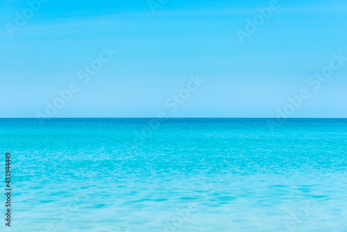 Blue sea water with sky and clouds background for nature blue texture © Pavlo Vakhrushev