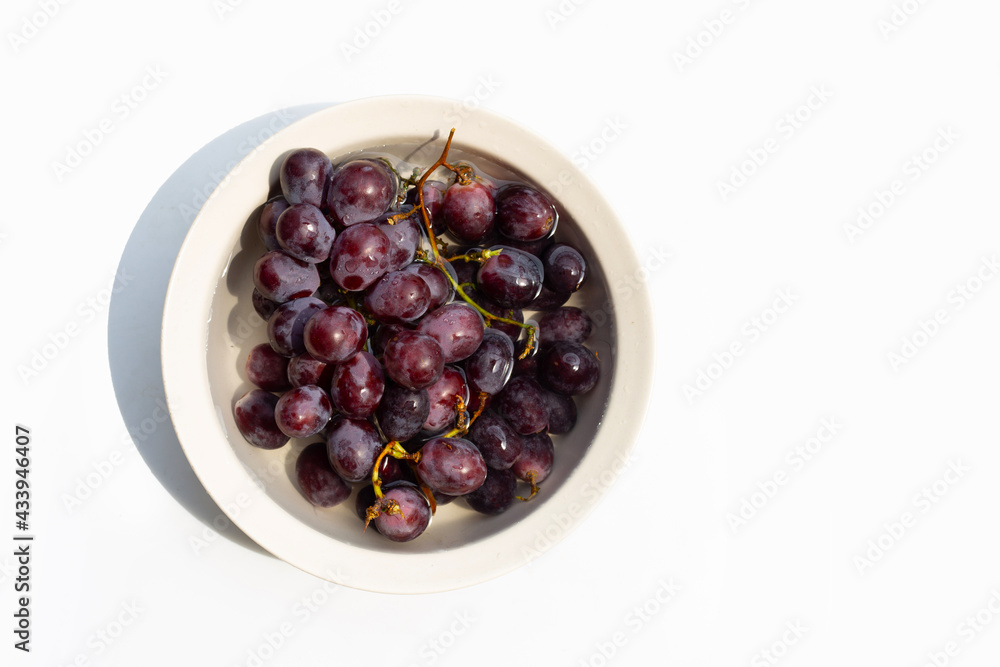 Soak grape in water. Washing fruit concept Soak grape in water. Washing fruit concept