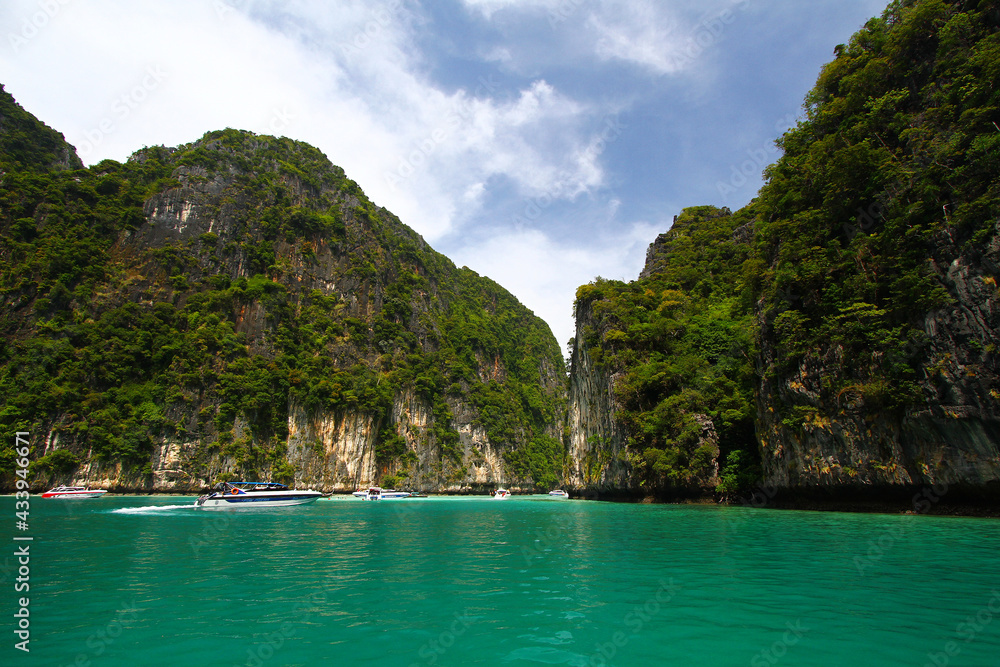 Landscape of Andaman sea view with rock mountain or island and speed boats take tourist, traveler or people to visit beach, beautiful ocean in Krabi, Thailand. Landmark for travel and Beauty nature. Landscape of Andaman sea view with rock mountain or island and speed boats take tourist, traveler or people to visit beach, beautiful ocean in Krabi, Thailand. Landmark for travel and Beauty nature.
