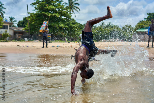 african teens play on the beach photo