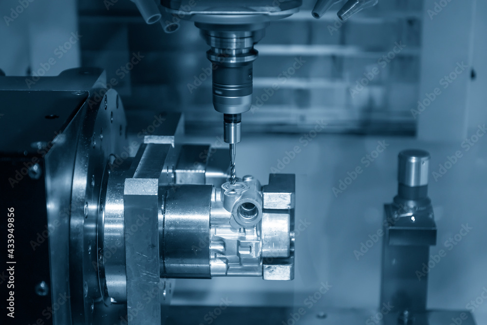 The 4-axis simultaneous machining center tapping the motorcycle gear case parts on the rotary table. The hi-precision automotive manufacturing process by multi-axis CNC milling machine. The 4-axis simultaneous machining center tapping the motorcycle gear case parts on the rotary table. The hi-precision automotive manufacturing process by multi-axis CNC milling machine.