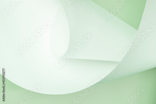 A large sheet of white paper in a green tint.