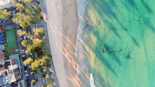 Beautiful aerial bird's eye drone flight along famous Manly Beach and promenade, a beachside suburb and part of the Northern Beaches area of Sydney, New South Wales, Australia. Late afternoon sun. photo
