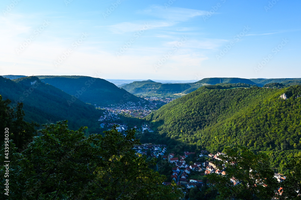 Scenic view of forested mountains of the Schwäbische Alb. The villages of Lichtenstein and Honau are located in the middle of the valley.