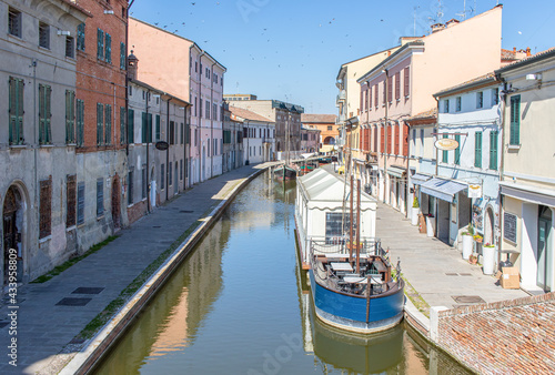 
Comacchio, Italy - often compared to Venice for the canals and the architecture, Comacchio displays one of the most characteristic old towns in Emilia Romagna photo