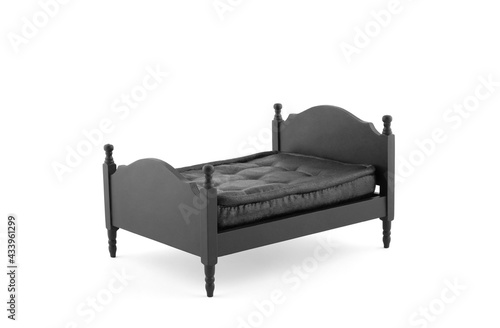 Foto Black wooden bed miniature on white background with clipping path