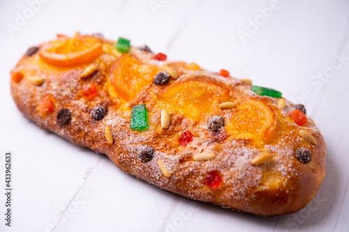 Coca de sant joan. Traditional San Juan cake to celebrate the arrival of summer in Spain made with brioche bread, candied fruit and nuts. photo