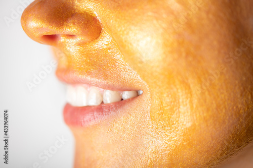 Trendy Gold face mask on womans face