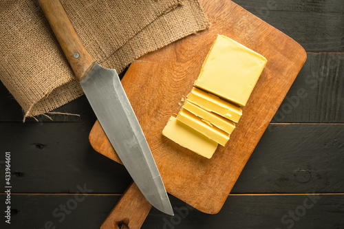 Chopped butter in wooden chopping board