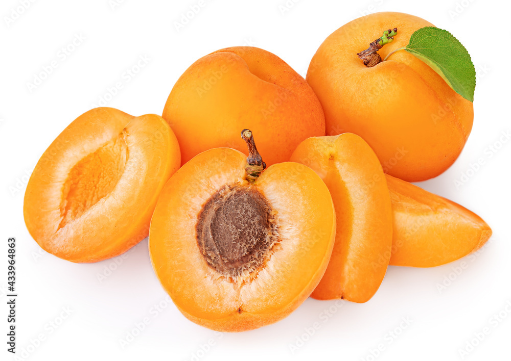 Isolated Apricots. Pile of Fresh Apricot fruits with a green leaves on white background Isolated Apricots. Pile of Fresh Apricot fruits with a green leaves on white background