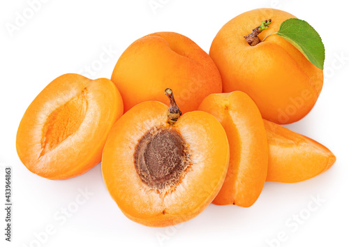 Isolated Apricots. Pile of Fresh Apricot fruits with a green leaves on white background
