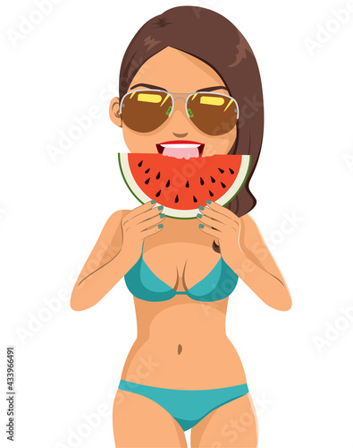 Beautiful young woman wearing bikini and sunglasses eating watermelon