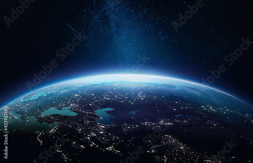 Planet Earth at night in the outer space. Earth surface. Abstract wallpaper with space and stars. City lights on planet. Elements of this image furnished by NASA 