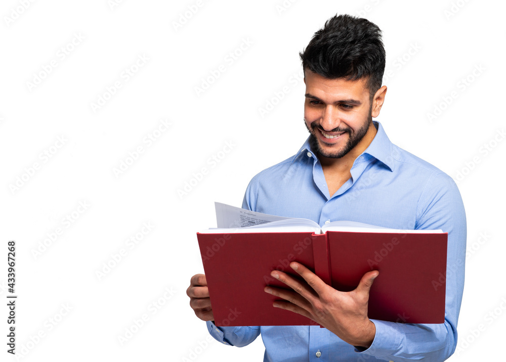 Young male student reading a red book isolated on white Young male student reading a red book isolated on white