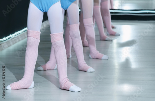 little girls are engaged in the class of a choreographic school