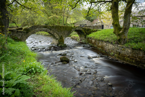 A long exposure photograph of the ancient pack horse bridge at Wycoller, Lancashire photo