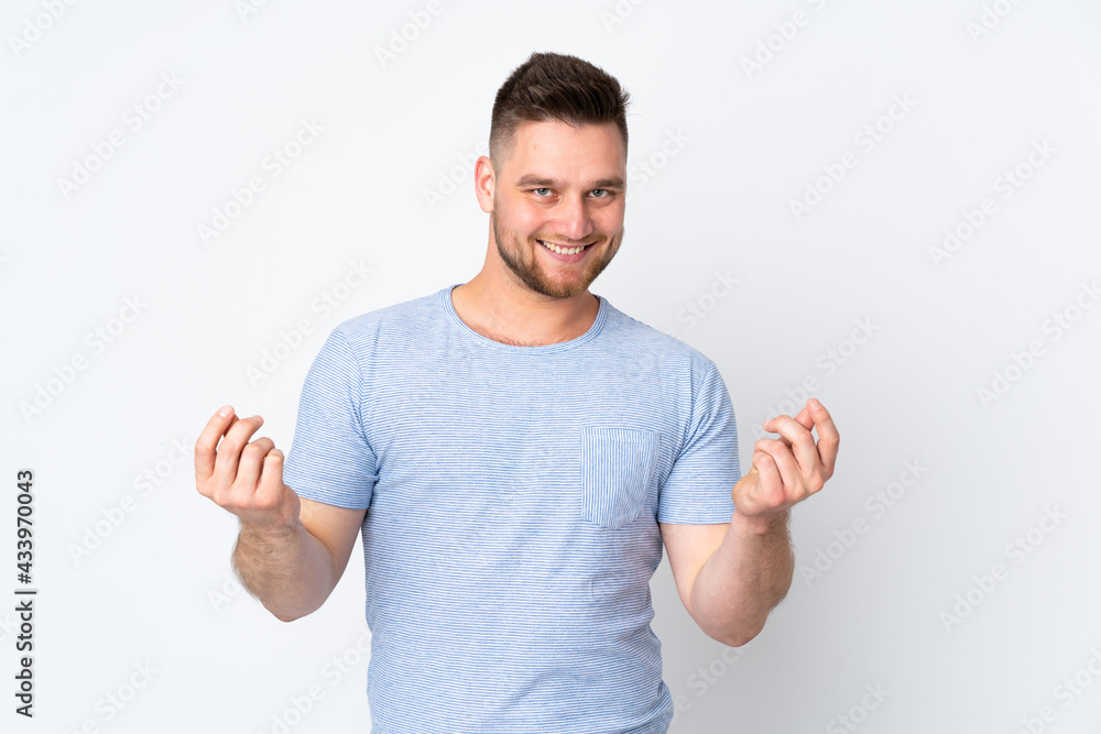 Russian handsome man over isolated background making money gesture Russian handsome man over isolated background making money gesture