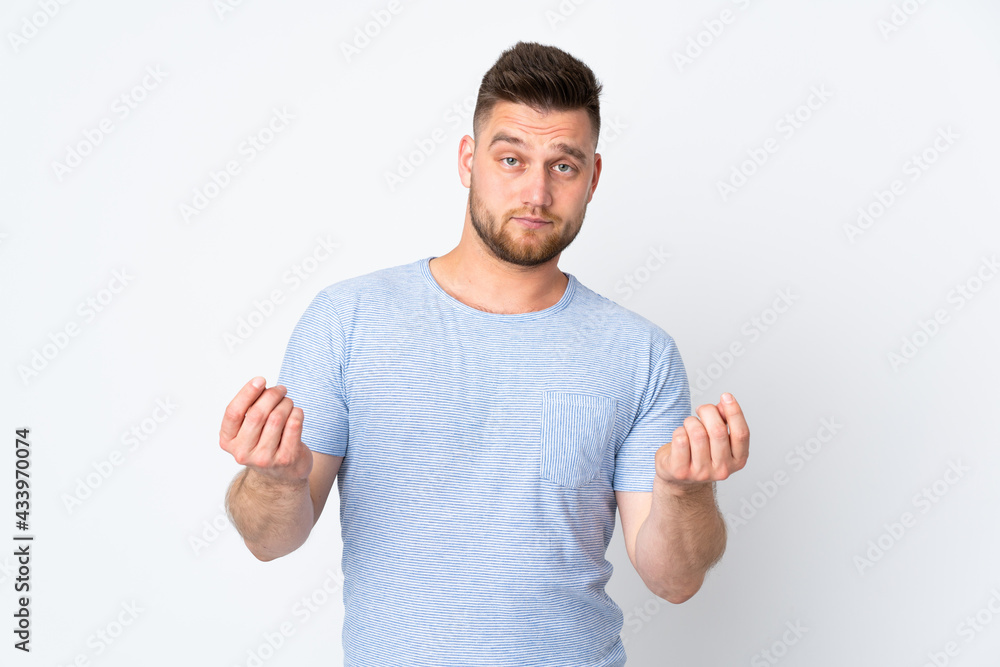 Russian handsome man over isolated background making money gesture but is ruined Russian handsome man over isolated background making money gesture but is ruined